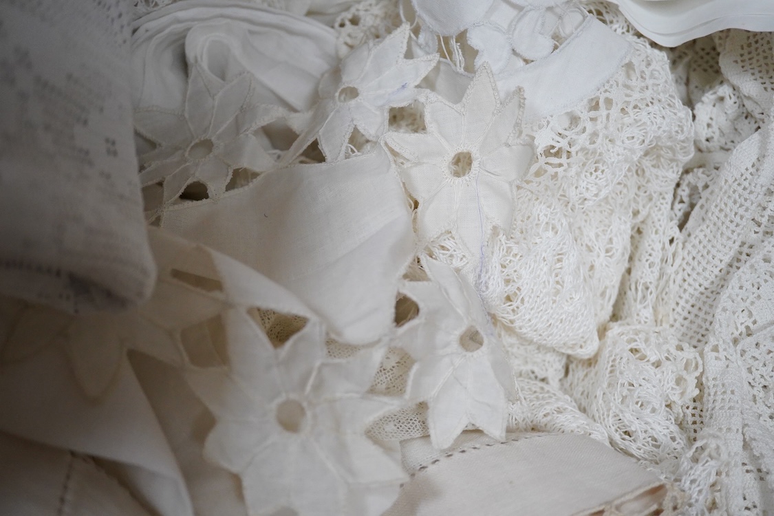 Two boxes of mixed white on white embroidered linen and cotton table cloths etc, some with crochet edging and cut work.